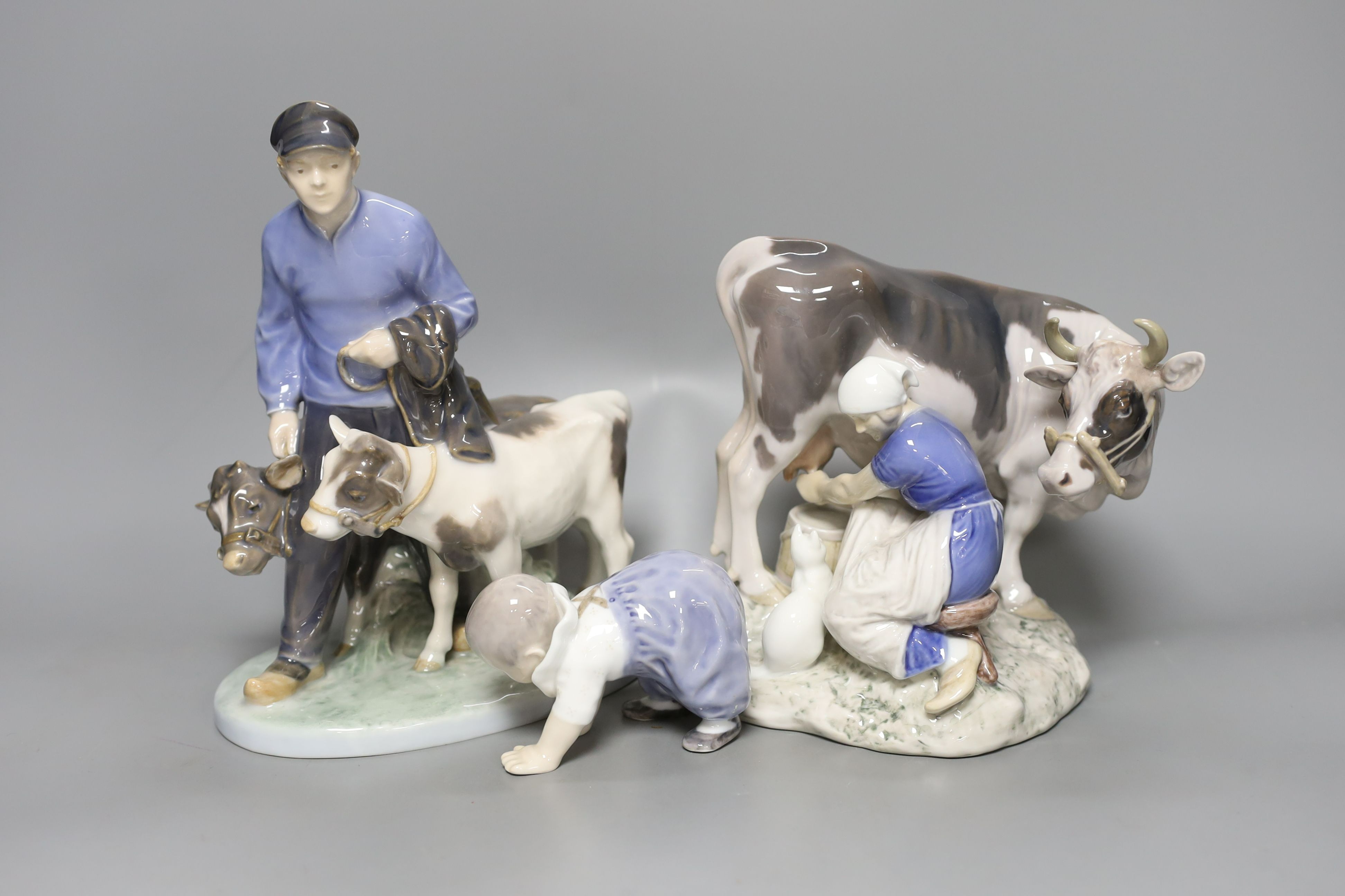 A Royal Copenhagen group, model number 1858 and a Bing and Grondahl group, model number 2017 and a small Royal Copenhagen figure of a child (3) - tallest 23.5cm